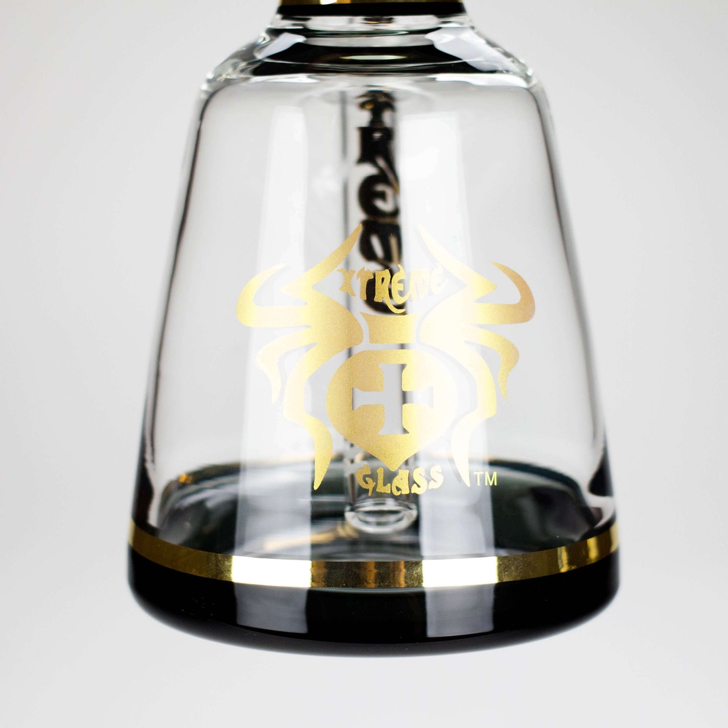 Close-up of Xtreme 11" beaker bong showcasing the signature gold logo and sleek design.