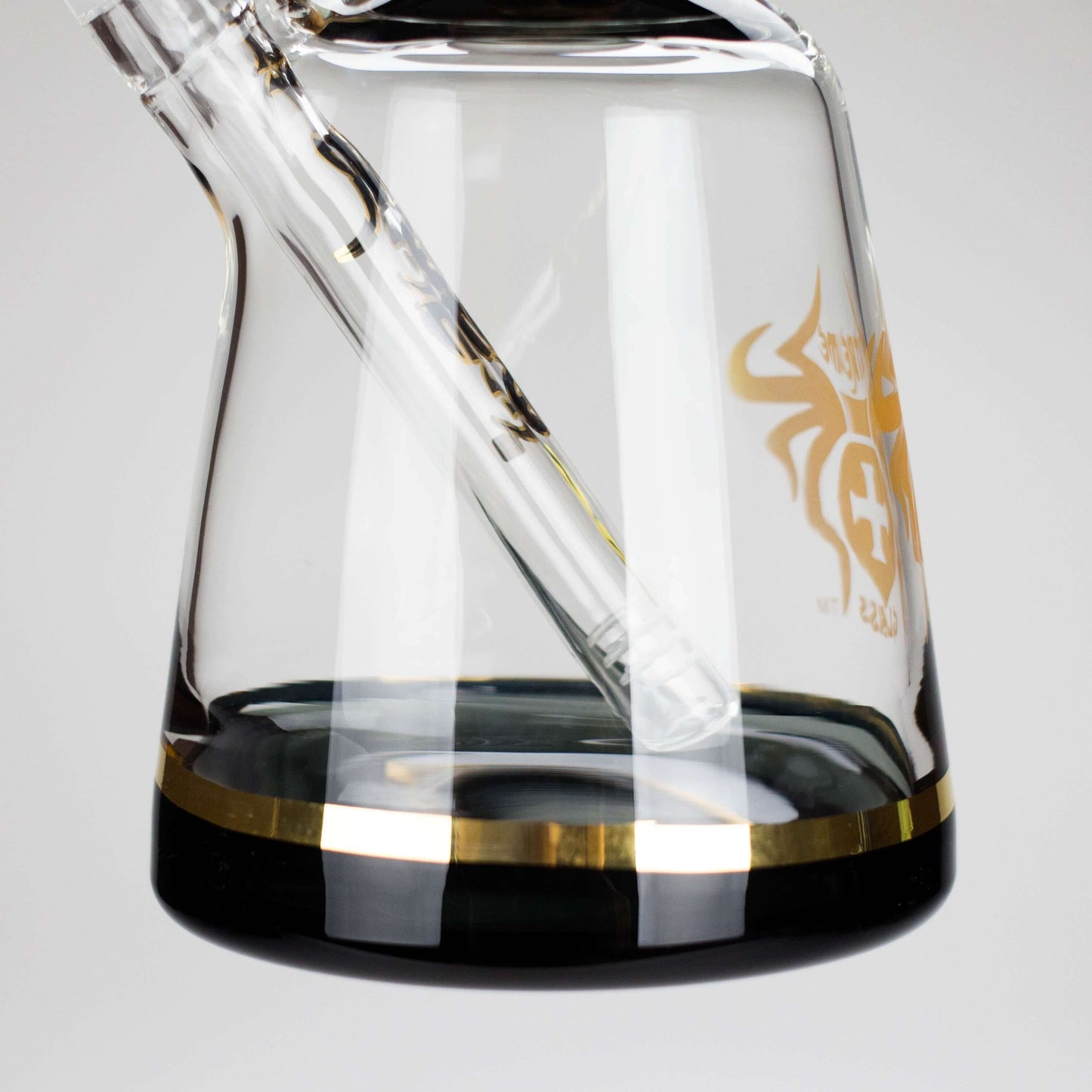 Close-up of Xtreme 11-inch Color Tube Beaker Bong showcasing glass design and gold accents.