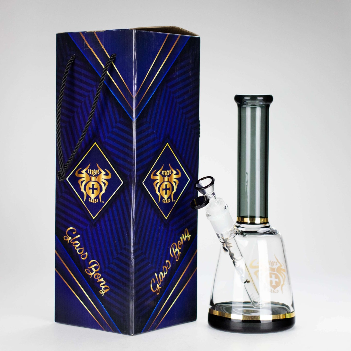 Xtreme 11-inch beaker bong in box, featuring durable borosilicate glass and a sleek design.